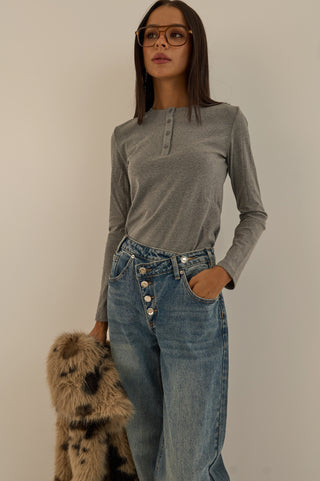 JEANS VITA ASIMMETRICA TWIST CON BOTTONI