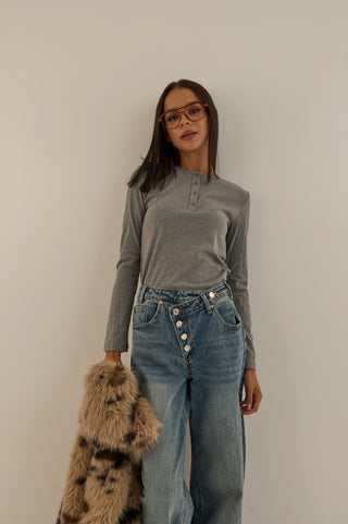 JEANS VITA ASIMMETRICA TWIST CON BOTTONI