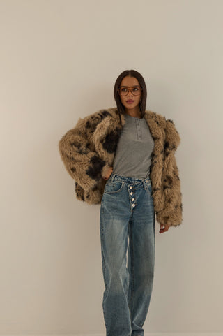 JEANS VITA ASIMMETRICA TWIST CON BOTTONI