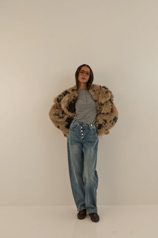 JEANS VITA ASIMMETRICA TWIST CON BOTTONI